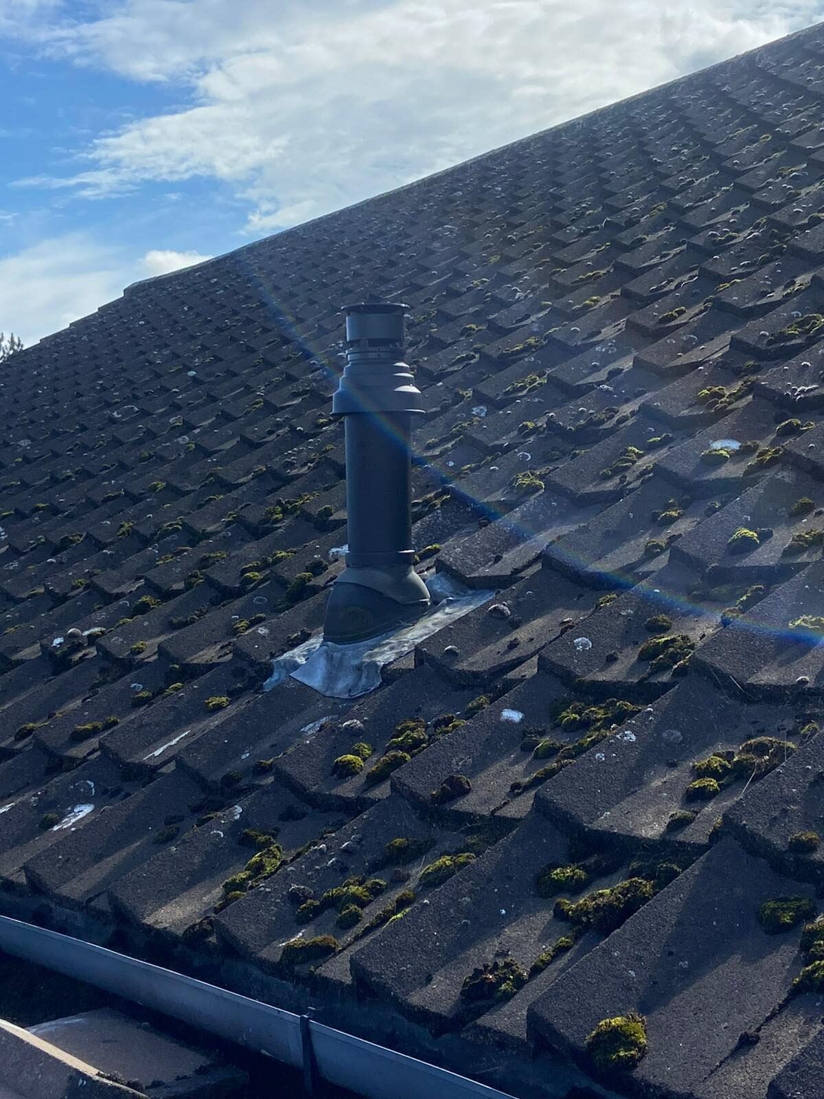 New boiler flue terminal correctly installed through a pitched roof in Bedfordshire — Gas Safe compliant flue work