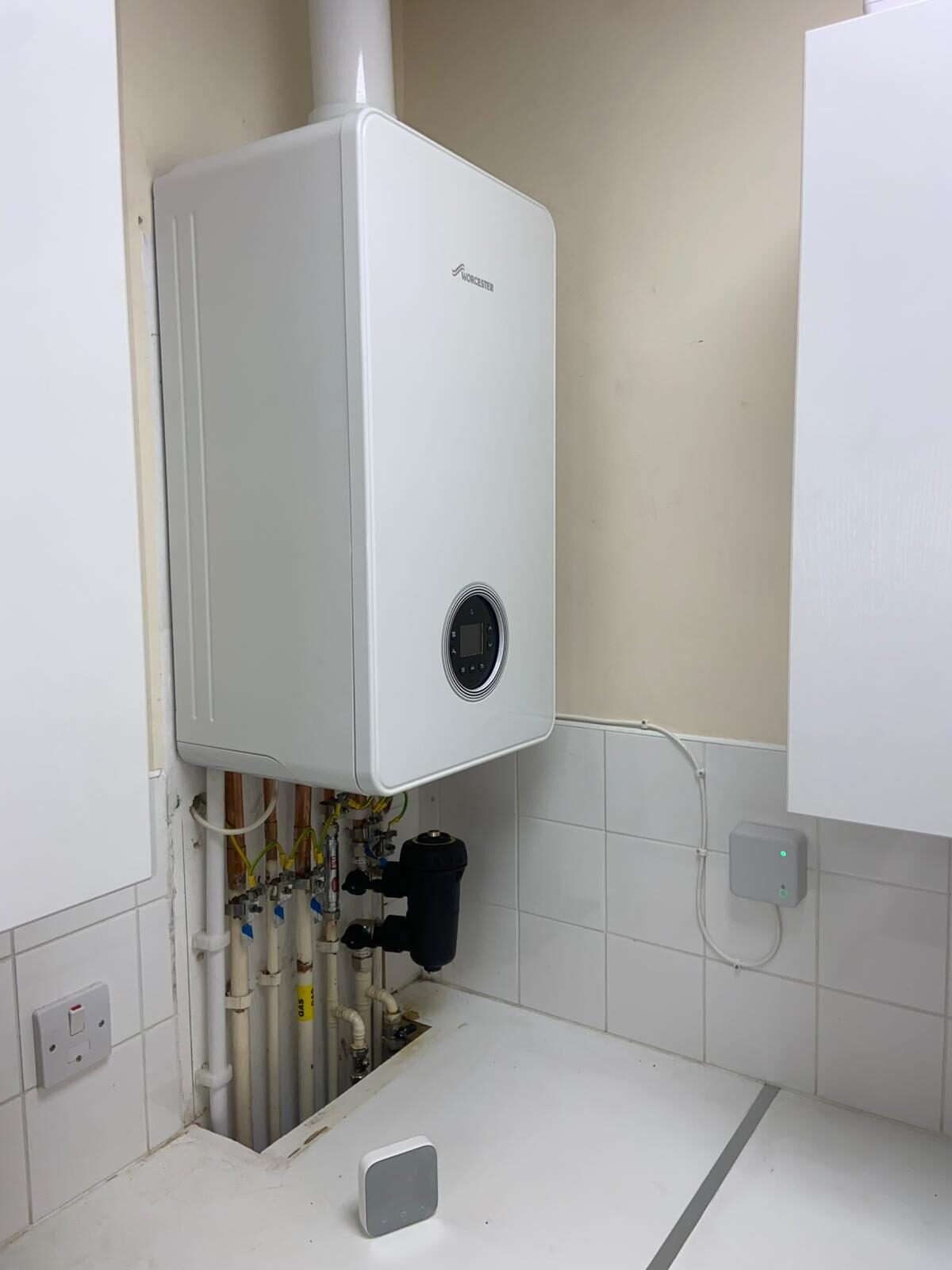 Wall-hung combi boiler serviced by a Gas Safe registered engineer — annual boiler service by On-Tap Plumbing & Heating