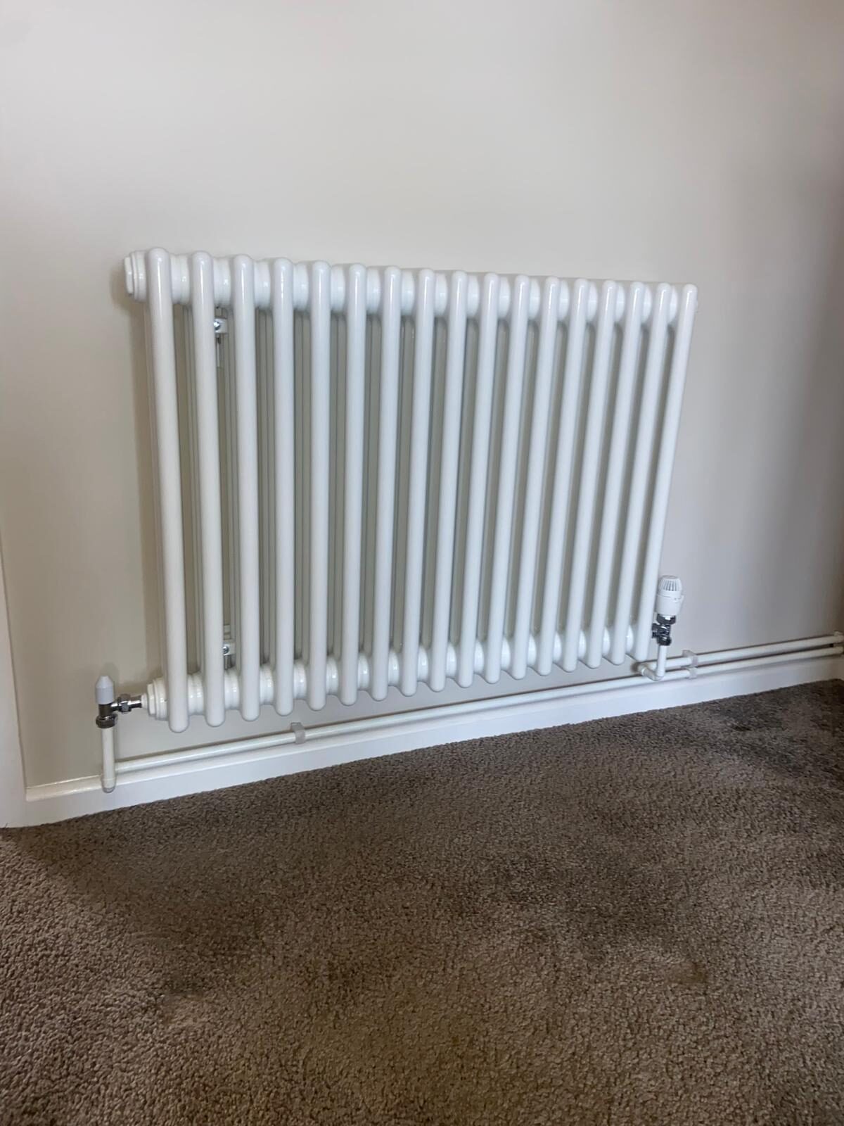 Classic white traditional column radiator installed in a Bedfordshire home by On-Tap Plumbing & Heating